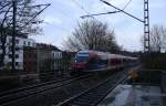 Zwei Euregiobahn (RB20) kommen aus Eschweiler-Sankt-Jöris nach Langerwehe-Stolberg-Altstadt und kommen aus Richtung Aachen-West und halten in Aachen-Schanz und fahren in Richtung Aachen-Hbf bei Schneeregenschauer am Kalten Nachmittag vom 29.1.2015.