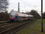 Zwei Euregiobahn (RB20) aus Eschweiler-Sankt-Jöris nach Düren-Stolberg-Altstadt und kommen die Kohlscheider-Rampe hoch aus Richtung Herzogenrath und halten in Kohlscheid und fahren in