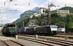 Zwei Loks der BR 189 von TXL verlassen am 15.6.2014 mit Doppeltaschenwagen den Bahnhof Kufstein in Richtung Brenner. Genau gesagt sind es 189 290-0 und 189 934-3 von TXL. Rechts im Hintergrund stehen zwei BR 139 von Lokomotion und links das abgestellte Krokodil 194 158-2 von Rail4U