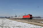 101 084 mit einem  EC  aus München kommend am 2. März 2023 bei Übersee am Chiemsee.