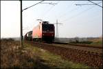 145 031-1 mit einem gemischten Gterzug bei Nudow, 24.02.2008