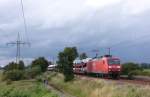 145 011-3 fuhr am 17.07.2012 mit einem Gterzug von Emden nach Osnabrck, hier sdlich von Leer.