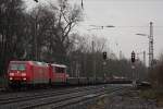 145 023 zieht am 1.2.13 eine 155er und einen Gterzug durch Ratingen-Lintorf.