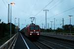 Durchfahrt am frühen Morgen des 18.04.2014 von 145 068-3 und einem Containerzug in Müllheim (Baden) gen Norden.