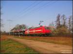 Der  Auto-Frhling  beginnt. Vorbei an den blhenden Mirabellenbumen am Hp Uebigau zieht heute die HGK-Lok 145-CL 011 den fast allmorgendlichen O...-Autozug gen Polen. Am Nachmittag stand er noch in dieser Zugbildung im Bf Guben. 16.03.07.