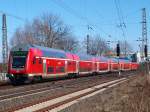 Der RE1 vor Aachen Rothe Erde wird am 03.03.2010 von 146 020-3 geschoben.