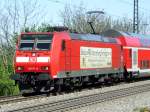 146 111 zieht am 07.04.2011 einen RE in den Bahnhof Heitersheim gen Sden.