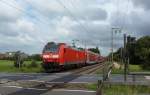 146 103-7 fuhr am 11.08.2012 mit einem RE von Norddeich Mole nach Hannover, hier in Eisinghausen.