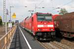 Ausfahrt von der Freiburger 146 238-1 mit einem RE nach Schliengen am 25.04.2014 in Müllheim (Baden) gen Auggen.