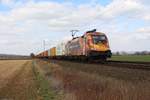 182 572 TXL (Wir brennen für das was wir tun) mit einem Containerzug bei Niedernjesa am 30.03.2018
