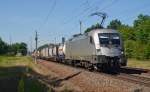 182 600 der Wiener Lokalbahn fuhr mit einem Bertschi-Zug am 07.07.15 durch Burgkemnitz Richtung Wittenberg.