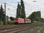 Aus Odenkirchen kommt die 185 387-8 mit einem Braunkohlezug am Haken in Rheydt eingefahren. 16.9.2018