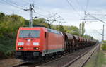 DB Cargo Deutschland AG mit  185 297-9  [NVR-Number: 91 80 6185 297-9 D-DB] und Ganzzug Schüttgutwagen am 26.09.18 Bf. Berlin-Hohenschönhausen.