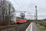 185 328 + 185 324 mit einem gemischten Güterzug am 12.12.2018 in Tornesch