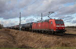 DB Cargo 185 043 am 15.01.2023 mit Kesselzug bei Groß Kiesow.
