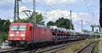 DB Cargo AG [D] mit ihrer  185 309-2  [NVR-Nummer: 91 80 6185 309-2 D-DB] und einem PKW-Transportzug am 19.07.23 Höhe Bahnhof Magdeburg-Neustadt.