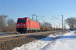 Am winterlichen 20.01.24 führte 185 310 einen gemischten Güterzug durch Greppin Richtung Dessau.