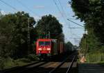 185 324-4 passiert am 13.09.2008 mit einem  van Dieren -Aufliegerzug Richtung Sden den Haltepunkt Prisdorf.