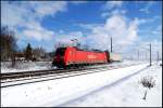 185 223-5 durchfhrt mit dem 53202 von Stralsund nach Rostock-Seehafen am 17.02.2009 den Bahnhof Martensdorf.