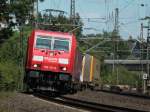 185 311-8 zieht am 15.07.2011 einen Containerzug auf der KBS 480 von Kln kommend bei Aachen Rothe Erde nach Aachen West.
