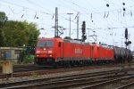 Die 185 238-3 von Railion und 185 388-6 DB fahren mit einem lzug aus Antwerpen-Petrol nach Basel(CH) bei der Ausfahrt in Aachen-West bei Herbstwetter.