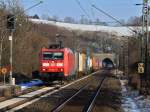 185 062-7 am 11.02.2012 mit einem bunten Containerzug am Haken auf der KBS 480 bei Eilendorf auf dem Weg nach Aachen West.