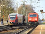 Ein Nachschuss von der 185 275-5 von Railion fährt als Lokzug aus Aachen-West in Richtung Herzogenrath,Neuss. RB20 nach Aachen-Hbf hält auf dem Nachbargleis in Kohlscheid bei Sonne am 29.3.2012.