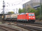 185 316-7 DB kommt aus Richtung Kln mit einem Kesselzug aus Kesselzug aus Ludwigshafen-BASF nach Antwerpen-BASF und fhrt in Aachen-West ein bei Aprilwetter mit Wolken am 23.4.2012.