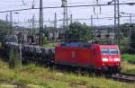 DB 185 041-1 vor Militrzug der Bundeswehr Regen - Bergen, fotografiert in Halle / Saale am 06.07.2011