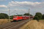 185 053-6 mit einem Autozug auf dem Weg in Richtung Braunschweig. Fotografiert am 25.08.2013 in Magdeburg Diesdorf. 