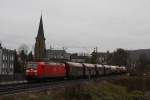 185060 rollt am 1.2.2014 mit einem kurzen Güterzug durch Königswinter in Richtung Süden.