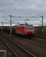 185 081-7 am S-Bahnhof Köln Weiden West mit einem Ölzug unterwegs in Richtung Ehrenfeld. 8.2.2014