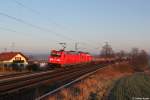 185 234 und 1016 025 mit einem Güterzug am 29.03.2014 bei Ostermünchen.