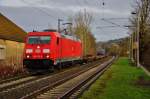 185 275-5 ist zu sehen mit einen Aufliegerzug in Richtung Süden am 15.12.14 im Bhf. von Ludwigsau-Friedlos.