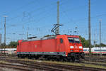 DB Lok 185 394-4 durchfährt solo den badischen Bahnhof.