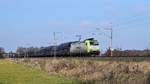 Captrain Deutschland 185 549 mit leerem Schüttgutwagenzug Bremen Stahlwerke - Bottrop Süd am (Hüde, 15.03.18).