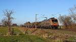 BRLL 185 597, vermietet an HSL Logistik, mit Saarrailzug DGS 69471 Brake (Weser) - Neunkirchen (Saar) Hbf (Hüde, 02.03.2021).