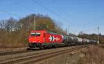 Alpha Trains Belgium 185 606, vermietet an RheinCargo (bis Aug. 2012 an HGK (2064)), zieht einen Kesselwagenzug am 08.03.15 durch den ehemaligen Bahnhof Vehrte in Richtung Osnabrck.