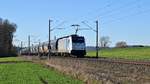 Railpool 186 433, vermietet an HSL Logistik, mit Ermewa-Schüttgutwagen in Richtung Hannover (zwischen Melle und Bruchmühlen, 15.02.19).
