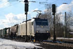 186 424-8 von Railpool passiert das Asig in Scheeßel 11.02.21