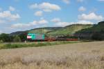 186 243 im Einsatz fr RTS mit einem Schienenzug am 02.08.2011 bei Himmelstadt.