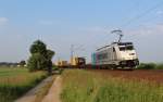 Am 12.Juni 2013 war Metrans E186 291 mit einem Containerzug bei Burgstemmen auf der NSS Richtung Norden unterwegs.