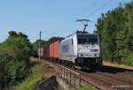 Nach einer lngeren Zugpause fhrt 186 291-1 METRANS am 11.07.13 mit einem langen Containerzug durch Hamburg-Moorburg Richtung Waltershof.