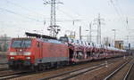 DB Cargo Deutschland AG mit  189 063-1  [NVR-Number: 91 80 6189 063-1 D-DB] und PKW-Transportzug (VW-Nutzfahrzeuge aus polnischer Produktion) am 06.03.19 Bf. Flughafen Berlin-Schönefeld.