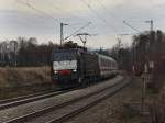 Die ES 64 F4-010 am 20.03.2010 mit einem Brenner EC unterwegs bei Grokarolinenfeld.