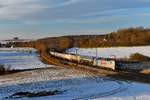 193 828 mit einem Kesselzug am 24.02.2018 bei Edlhausen. 