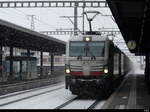 ATLU - Lok 91 80 6 193 596-4 vor Güterzug bei der durchfahrt im Bhf. Münsingen am 02.12.2023