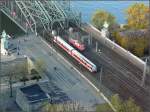 Whrend ein Triebzug der BR 628/928 die Hohenzollernbrcke in Richtung Kln Messe/Deutz verlsst, fhrt die 110 325-8 in Richtung Hbf Kln.