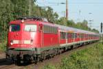 Die Braunschweiger 110 486-8 zieht die RB35 von Dsseldorf nach Emmerich in Dinslaken ein am 30.05.2011