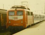 Lange vor Einsatz der ersten 101 auf der IR-Strecke Karlsruhe-Nrnberg fhrt 110 216-9 mit ihrem IR im Juli 1997 in den Bahnhof Crailsheim ein (digitalisiertes Dia).
